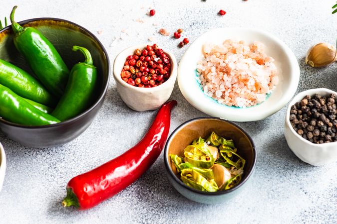 Red pepper surrounded by seasoning for cooking