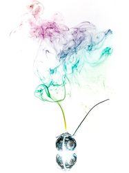 Jar with herbs emitting smoke