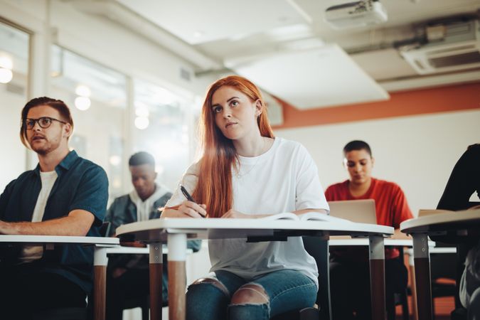 Woman sitting in college classroom