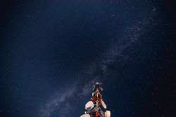 Radio tower against starry sky