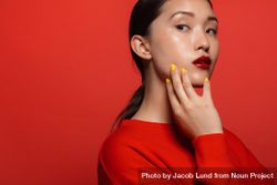 Young female model with red top and lipstick 4A3ZE0