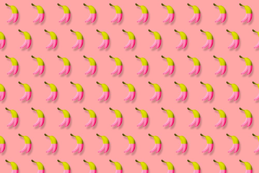 Pink and yellow bananas in rows