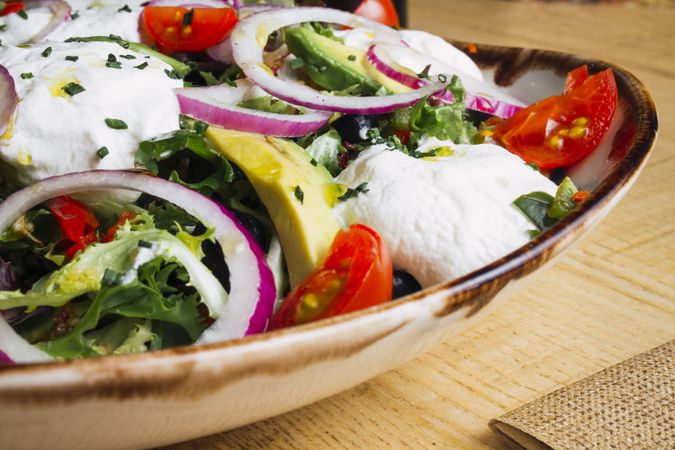 Vegetables salad with onion greens and cream sauce
