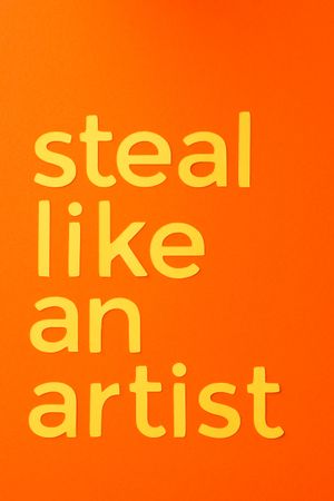 Steal like an artist quote made of paper over orange background
