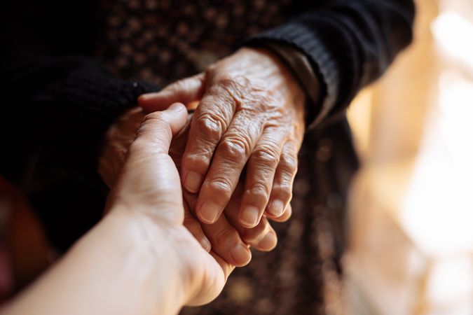 Man holding a woman's hand