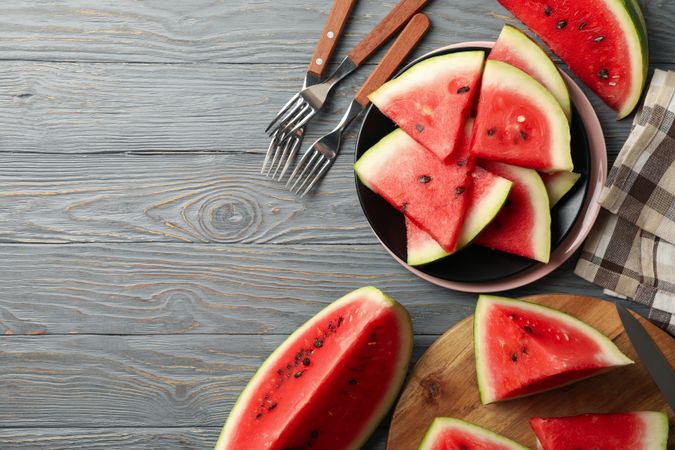 Composition with watermelon slices on gray wooden table. Summer fruit
