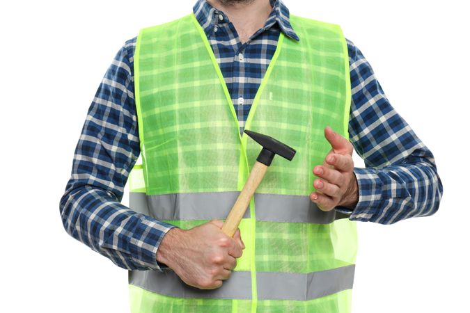 Young man civil engineer with hammer isolated on light background