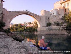 Man fishing near Stari Most bridge in Mostar, Bosnia and Herzegovina 5od6m4