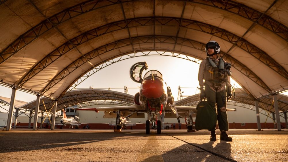 Kingsville, TX, USA - Jan 7,  2020: Lt. Madeline Swegle, in airplane hanger with fighter jet