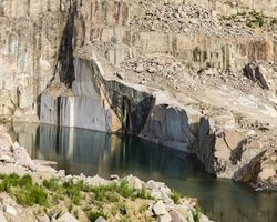 Calm water near stone quarry