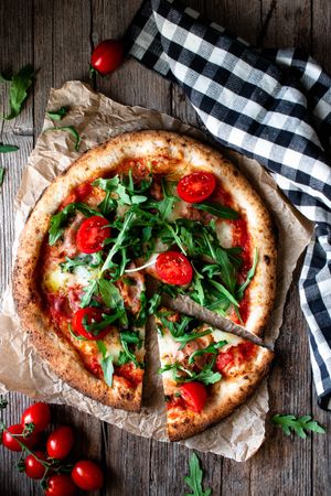 Appetizing pizza placed on wooden table