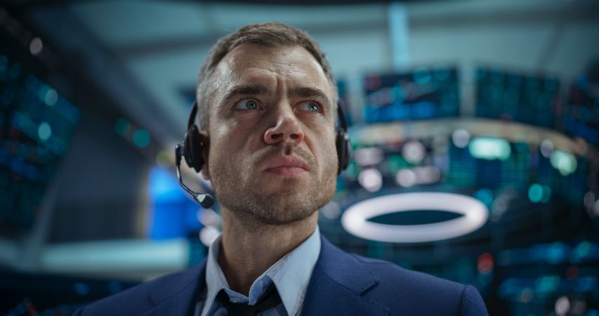 Portrait of a Handsome Stock Market Trader Working in a Stock Exchange Company.