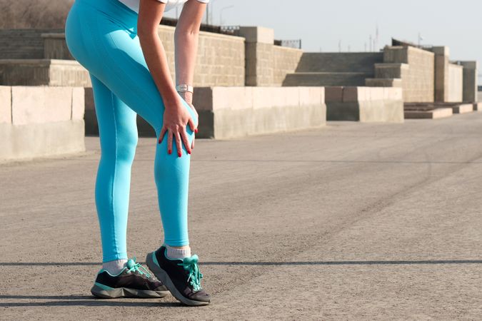 Young woman jogging on city streets