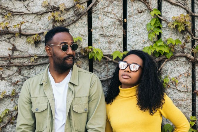 Stylish Black man and woman with sunglasses portrait
