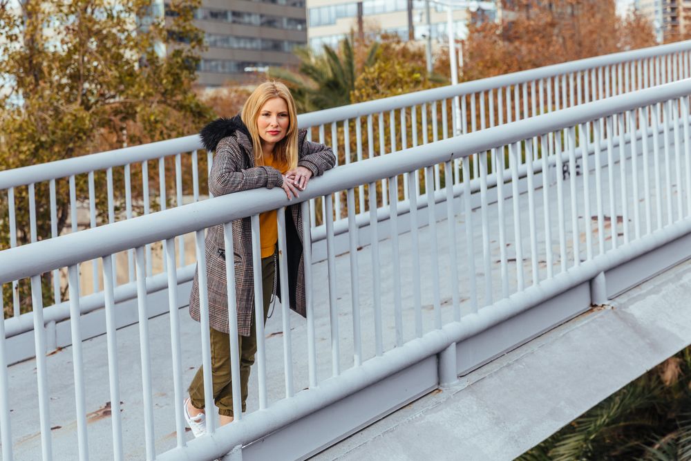 Blonde woman posing in the city