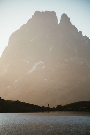 Majestic mountain landscape with human silhouette