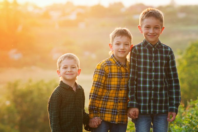 Three brothers at sunset