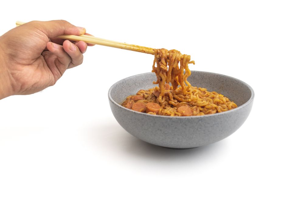 hand holding instant noodle
