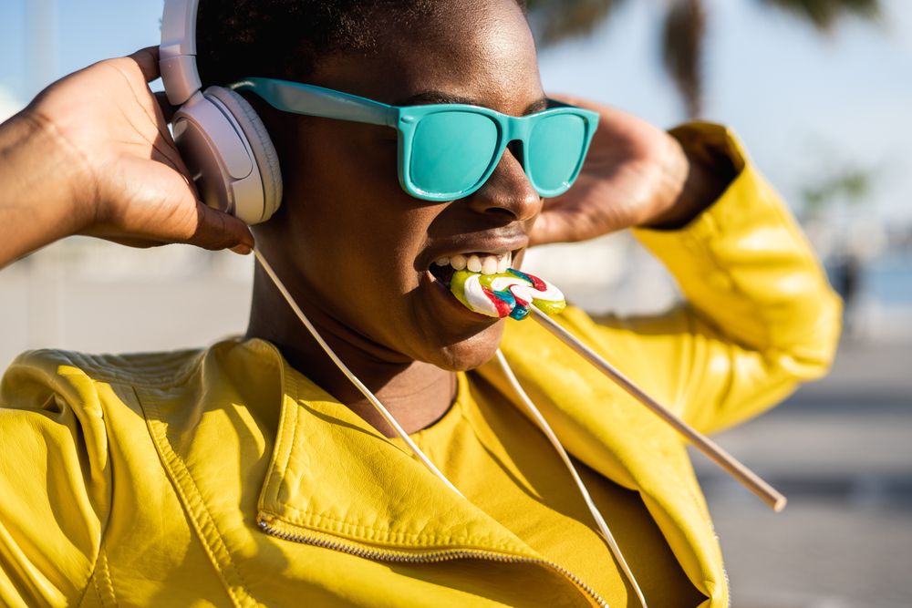 Black woman eating candy