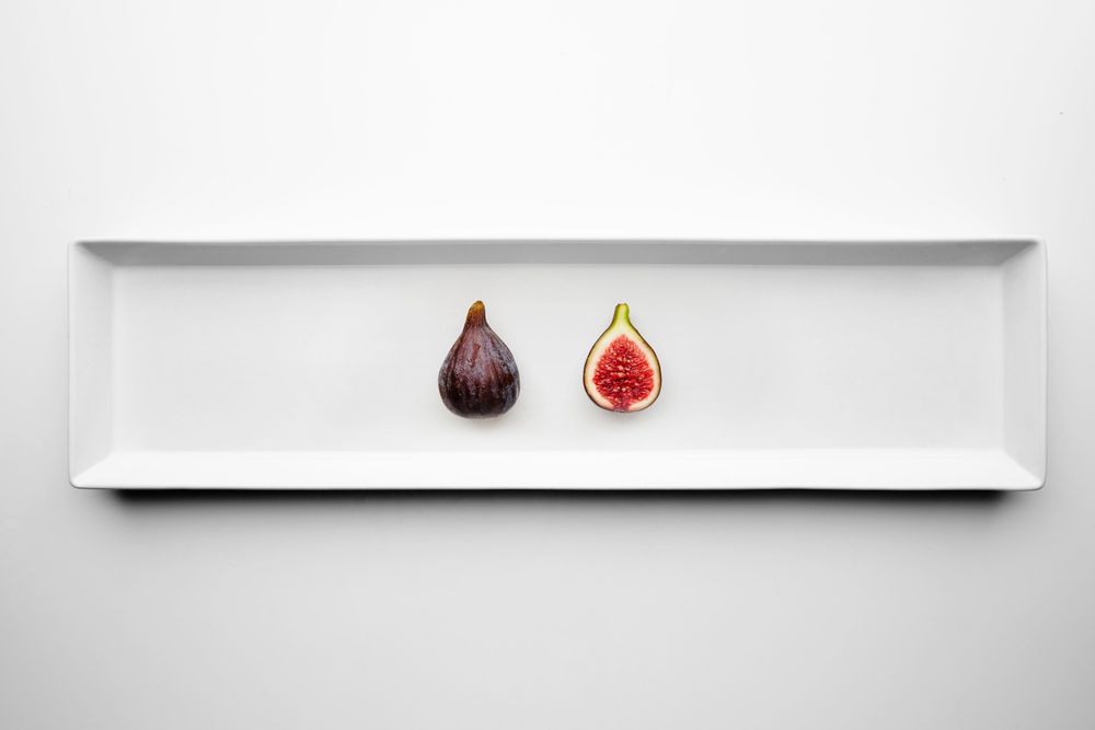 Halved fig on appetizer plate