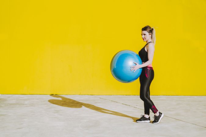 Woman holding a fitball