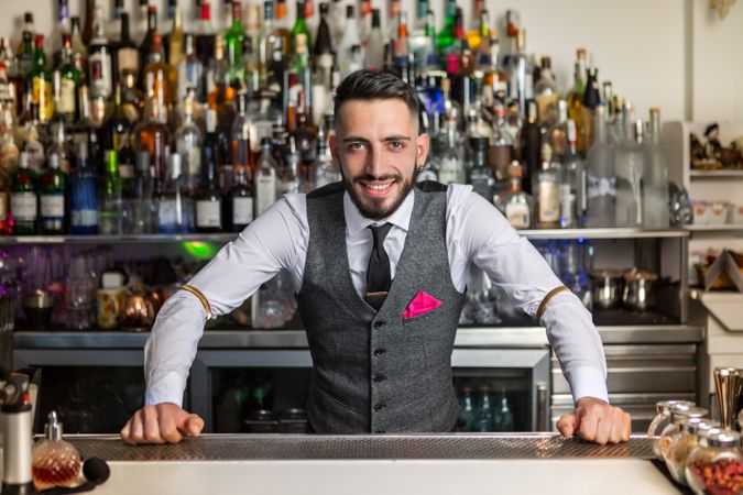 Smiling bartender ready to take an order