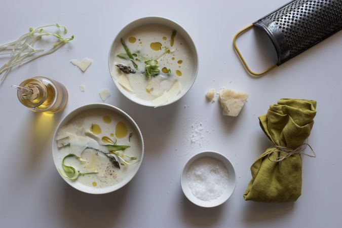 Kitchenware and condiments near asparagus cream soup