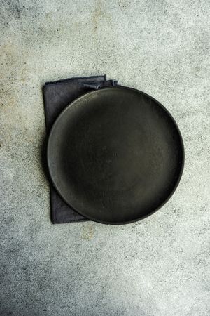 Top view of minimalistic dark table setting
