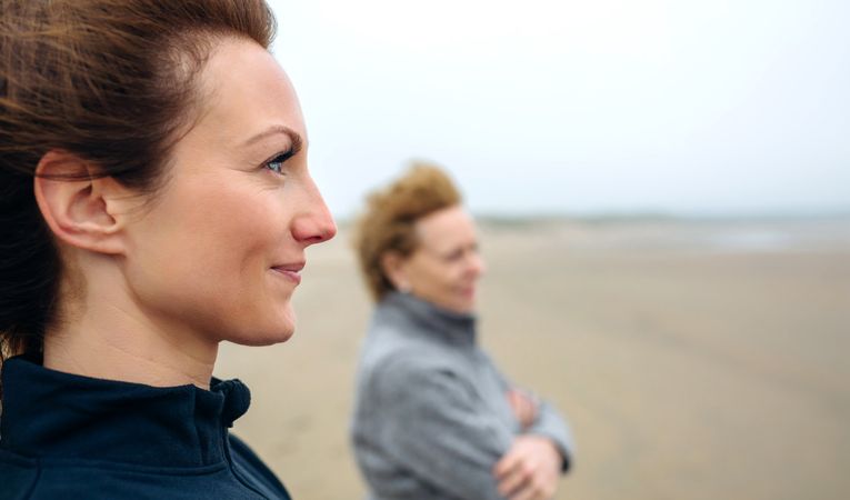 Two women looking at sea