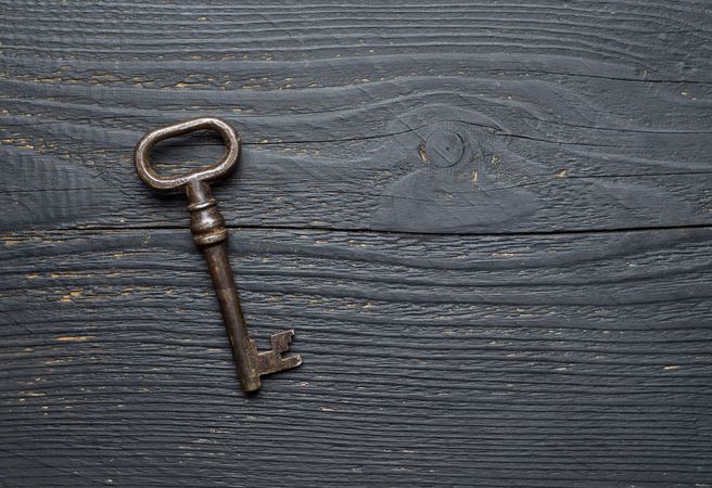 Vintage Key over dark wooden table