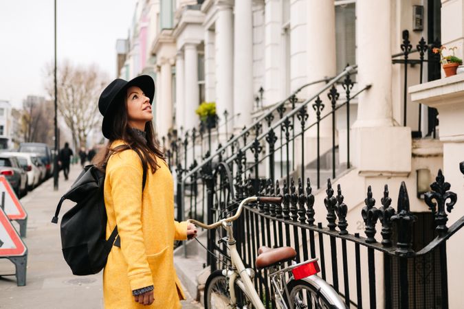 Female tourist looking at buildings on street