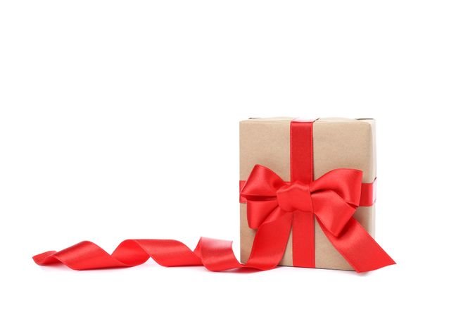 Gift box with red bow isolated on blank background