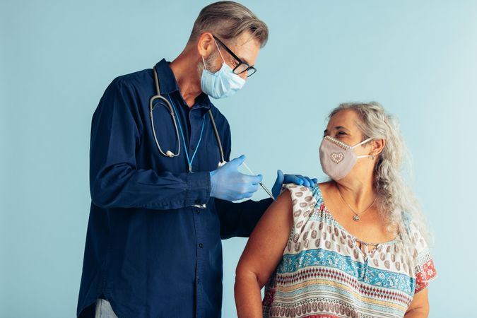Mature woman getting second coronavirus vaccine dose for full immunity