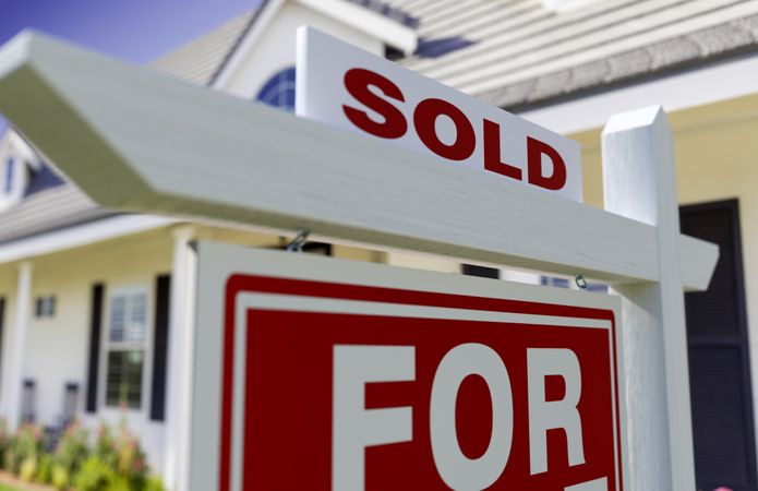 Sold For Sale Real Estate Sign In Front of New House.