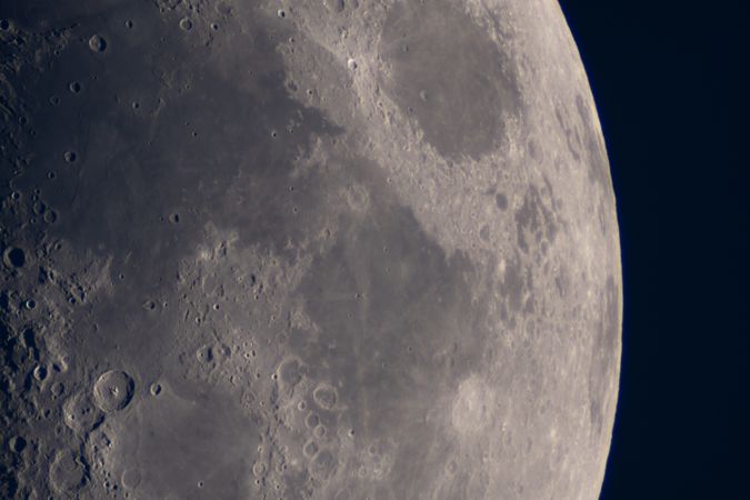 Detailed view of lunar surface featuring maria and craters.
