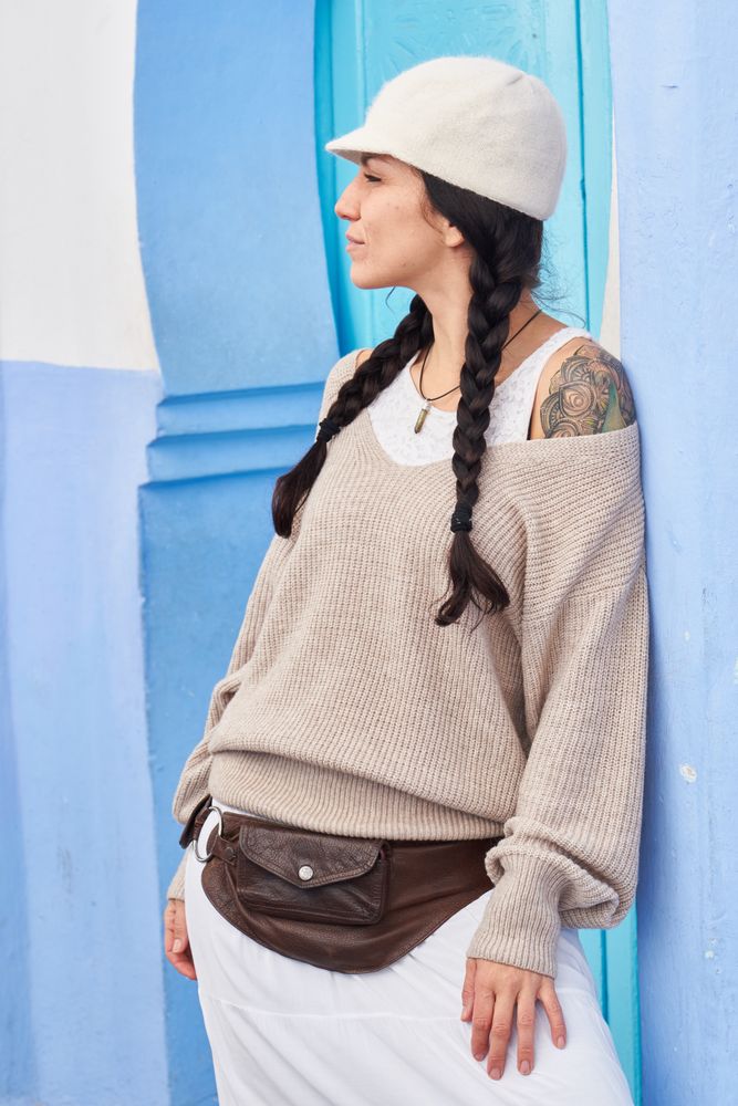 Smiling woman posing near vintage door