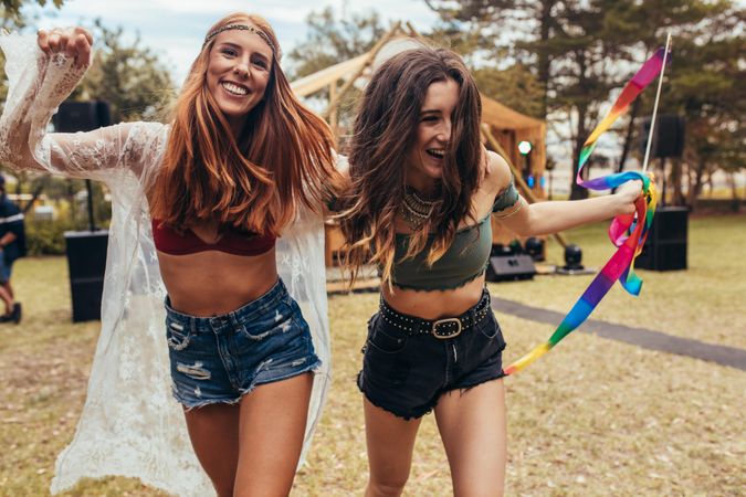 Hipster friends having fun at music festival outdoors