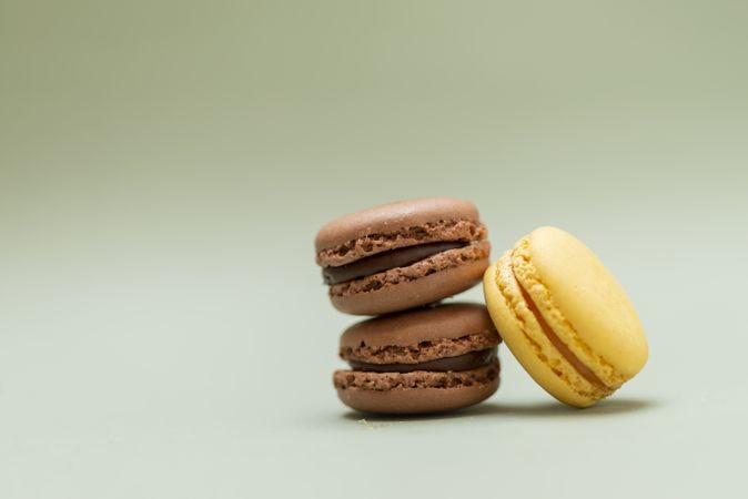 Chocolate & lemon macaroons on a green table