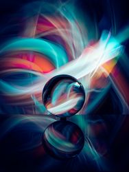 Crystal ball on board near abstract shines