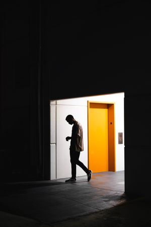 Man walking into a building