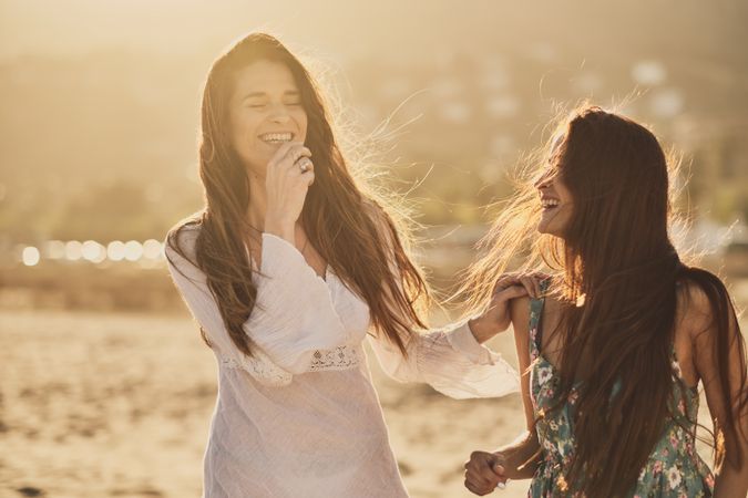 Two happy girls in a summer day at the beach