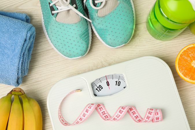 Healthy lifestyle accessories on neutral background, top view