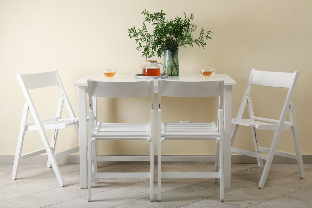kitchen table with tea and plant in bright room