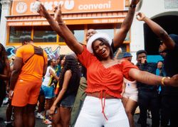 London, England, United Kingdom - August 28, 2022: Man and woman dancing in street