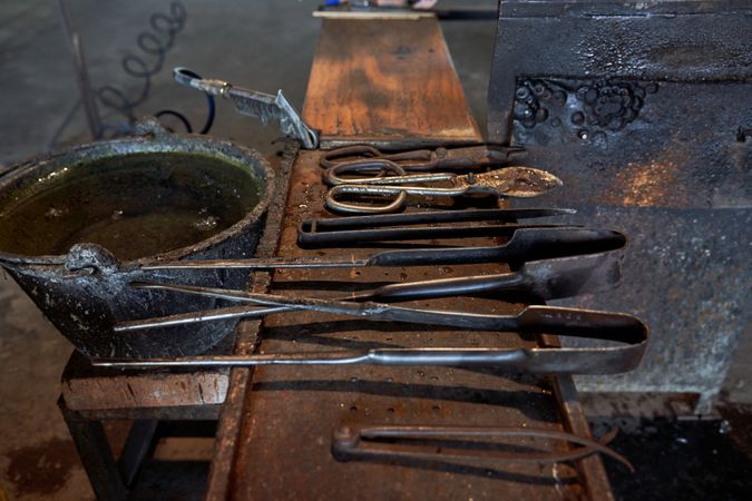 Set of metal tools inside dark building