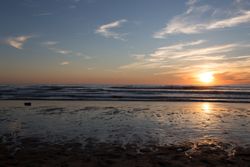 Picturesque view of sandy beach at sunset