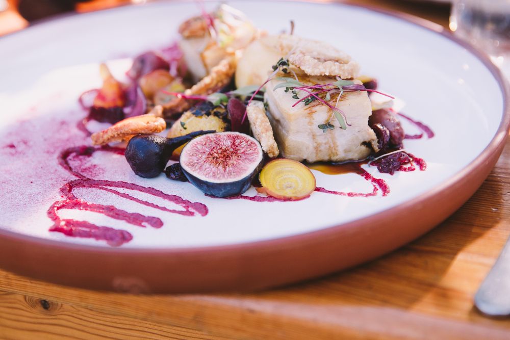 Elegantly plated dish featuring figs and beets