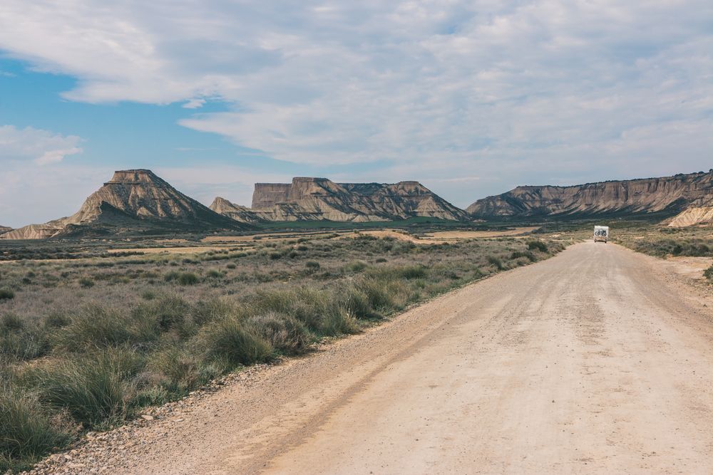 trailer on empty road along desert