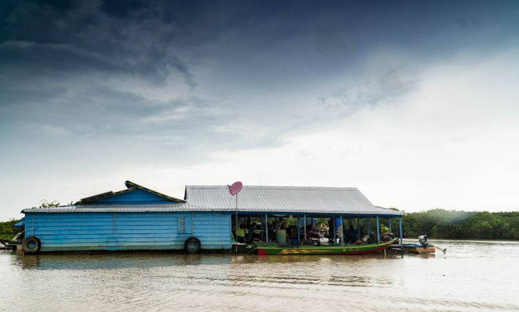 Floating poor house on river