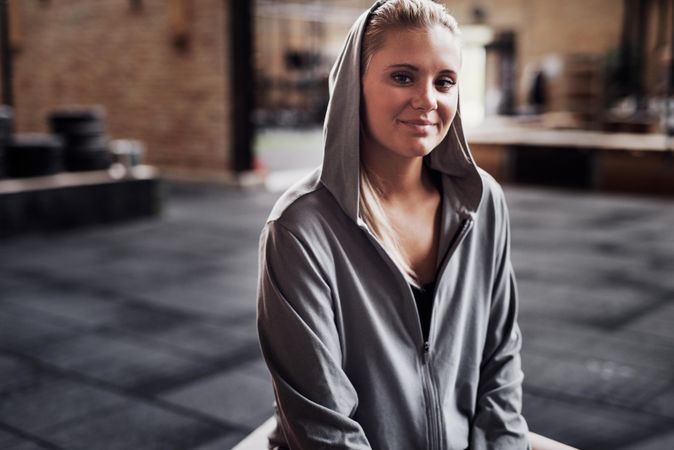 Woman smiling in hoodie